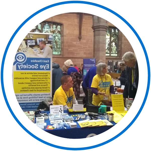two East Cheshire Eye society members at an event selling products and giving out information