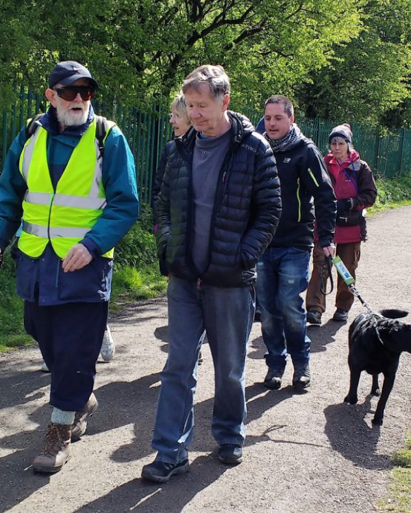 Members out on a group walk along a path