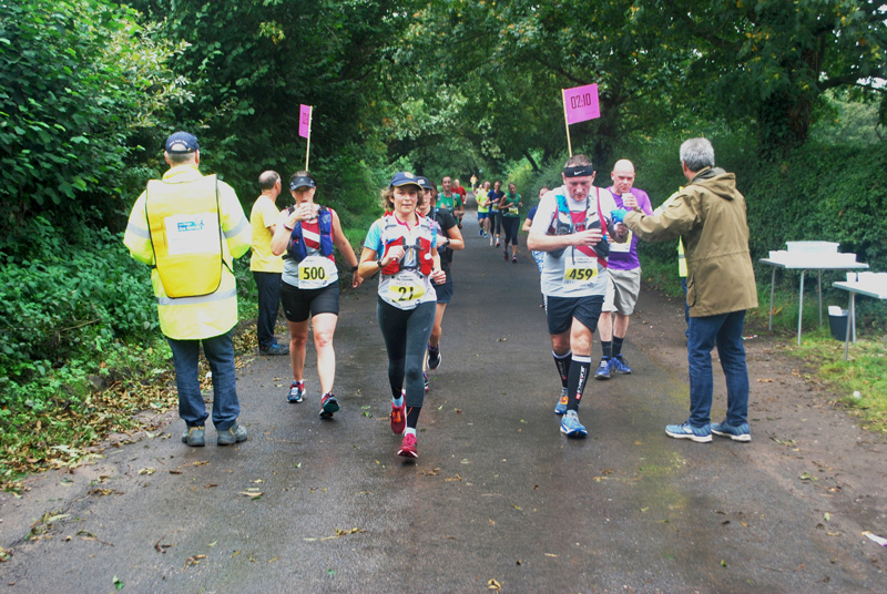 Volunteers handing out water for the Macclesfield Half Marathon