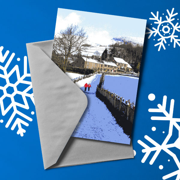 Mockup-1-WEB Christmas card with image of people walking down a snowy path